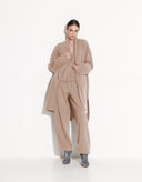 Full-length view of women’s beige long wool knit cardigan with relaxed fit