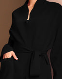 Close-up of Sophia black knit wrap cardigan with waist-defining belt.