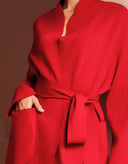 Red wrap-style cardigan with coordinating waist tie belt