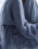 Detailed view of soft violet mohair knit cardigan decorated with rhinestones