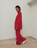 Women’s burgundy knit tunic and loose pants set with bead accents