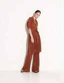 Side view of elegant women’s Italian viscose tunic and mesh pants set in cappuccino beige