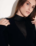Close-up of elegant black viscose bodysuit featuring a sheer mesh neckline