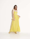 Woman wearing Lilia yellow viscose maxi dress with handmade lace by Aina Gasse