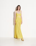Full-length view of women’s lightweight yellow viscose maxi dress with flowing skirt