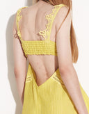 Close-up of handmade openwork lace on Lilia yellow viscose maxi dress